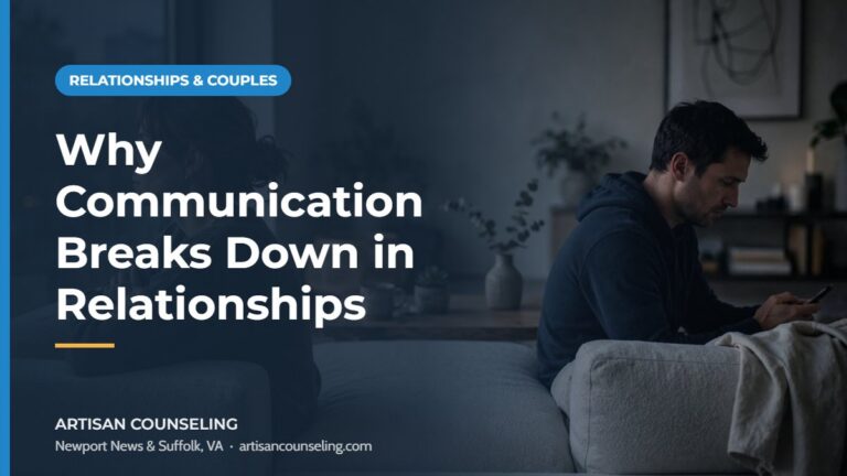 Couple sitting apart on a couch after an argument, featured image for an article on communication breakdown in relationships